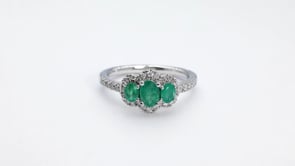 3-Stone Oval Emerald & 1/3 ct. tw. Diamond Halo Ring in 14K White Gold close-up detail