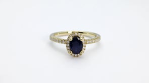 Oval Sapphire & 1/5 ct. tw. Diamond Halo Ring in 14K Yellow Gold close-up detail
