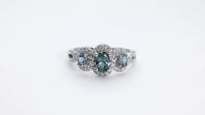 American Colors 3-Stone Oval Montana Sapphire & 1/4 ct. tw. Diamond Halo Ring in 10K White Gold close-up detail