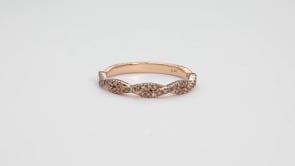 Perfect Match 1/4 ct. tw. Diamond Anniversary Band with Twist Design in 10K Pink Gold close-up detail