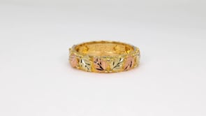 Black Hills Gold Men's Grape & Leaf Textured Finish Wedding Ring in 10K Yellow Gold close-up detail