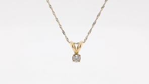 1/10 ct. tw. A Quality Round Diamond Solitaire Pendant in 14K Yellow Gold front view