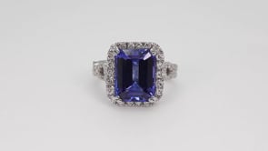 Emerald Cut Tanzanite & 1-1/10 ct. tw. Diamond Halo Twist Ring in 14K White Gold side profile