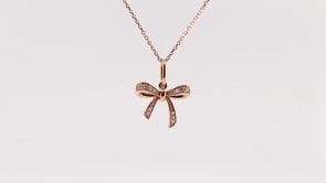 Love Knot Diamond Accent Bow Pendant in 10K Pink Gold close-up detail