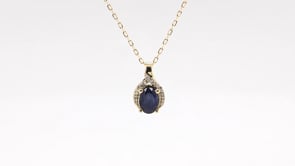 Oval Sapphire & Diamond Halo Pendant in 10K Yellow Gold front view