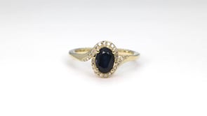 Oval Sapphire & 1/10 ct. tw. Diamond Bypass Halo Ring in 10K Yellow Gold side profile