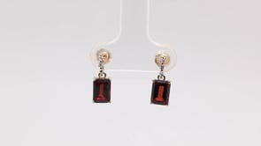 Emerald Cut Garnet & Diamond Accent Drop Earrings in 10K Yellow Gold close-up detail