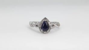 Infinite Love Pear Sapphire & 1/5 ct. tw. Diamond Halo Twist Ring in 10K White Gold angled view