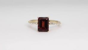 Emerald Cut Garnet & 1/6 ct. tw. Diamond Ring in 10K Yellow Gold angled view