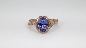 Oval Tanzanite & 1/4 ct. tw. Diamond Halo Twist Ring in 14K Pink Gold close-up detail