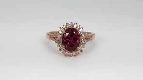 Oval Rhodolite Garnet & 3/8 ct. tw. Baguette & Round Diamond Starburst Halo Ring in 14K Pink Gold close-up detail
