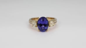 Oval Tanzanite & 7/8 ct. tw. Yellow & White Diamond Ring in 14K Yellow Gold close-up detail