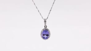 Oval Tanzanite & 1/6 ct. tw. Diamond Halo Pendant in 14K White Gold front view