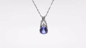 Round Tanzanite & 1/10 ct. tw. Diamond Twist Pendant in 14K White Gold front view
