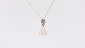 Pear Opal & 1/10 ct. tw. Diamond Cluster Pendant in 14K Yellow Gold front view