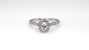 Natural 1-1/10 ct. tw. Oval Diamond Halo Engagement Ring in Platinum side profile