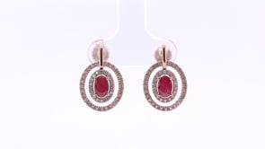 Oval Ruby & 1/4 ct. tw. Diamond Double Floating Halo Earrings in 10K Pink Gold front view