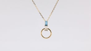 Baguette Swiss Blue & White Topaz Circle Pendant in 10K Yellow Gold front view