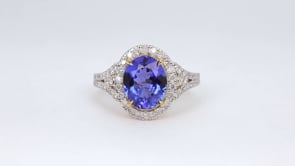 Oval Tanzanite & 1/2 ct. tw. Diamond Halo Ring in 14K Yellow Gold close-up detail