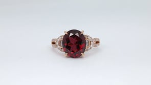 Oval Rhodolite Garnet & 3/8 ct. tw. Round & Baguette Diamond Split Shank Ring in 14K Pink Gold close-up detail