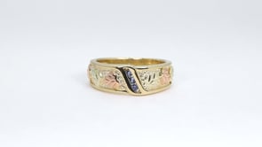 Black Hills Gold Round 3-Stone Yogo Sapphire Channel Set Wedding Ring in 10K Yellow Gold close-up detail