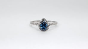1 ct. tw. Pear Treated Blue & White Diamond Halo Engagement Ring in 14K White Gold close-up detail