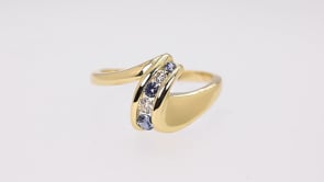 Yogo Sapphire & 1/10 ct. tw. Diamond Graduated Wave Ring in 10K Yellow Gold close-up detail