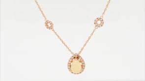 Pear Opal & 1/4 ct. tw. Diamond Halo & Chain Accent Pendant in 14K Yellow Gold front view