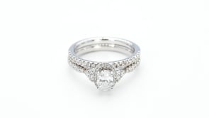 Noventa 1 ct. tw. Oval Diamond Hidden Halo Wedding Set with Cluster Diamond Accented Band in 14K White Gold side profile
