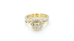 Noventa 1-1/5 ct. tw. Cushion Cut Halo Wedding Set with Twist Band in 14K Yellow Gold full view