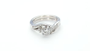 True Promise 1/4 ct. Round Brilliant Diamond Wedding Set with 1/5 ct. Diamond Swirl Accent Band in 10K White side profile