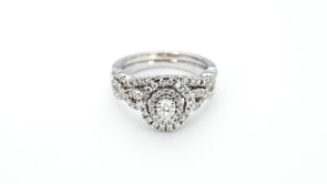 Natural 1 ct. tw. Oval Diamond Double Halo Twist Wedding Set in 10K White Gold side profile