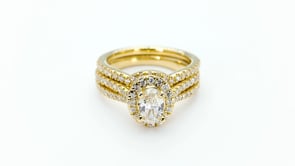 Noventa 1-1/2 ct. tw. Oval Diamond Halo Wedding Set with Cut-Out Band in 14K Yellow Gold full view