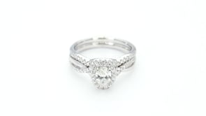 Canadian Rocks 5/6 ct. tw. Oval Diamond Halo Wedding Set with Twisted Designed Band in 14K White Gold full view