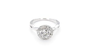 Natural 1-1/3 ct. tw. Round Brilliant Diamond Halo Twist Engagement Ring in 14K White Gold angled view