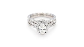 Noventa 1-1/2 ct. tw. Oval Diamond Halo Wedding Set with Cut-Out Accented Band in 14K White Gold full view