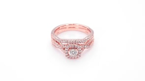 True Promise 5/8 ct. tw. Round Brilliant Diamond Halo Wedding Set with Twisted Band Design in 10K Pink Gold front view