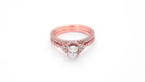 Noventa 1 ct. tw. Oval Diamond Hidden Halo Wedding Set with Cluster Diamond Accented Band in 14K Pink Gold side profile