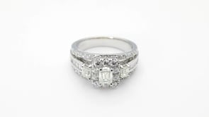 Amaura 2 ct. tw. Emerald Cut Diamond Halo Engagement Ring with Round & Straight Baguette Diamond Band in 14K close-up detail