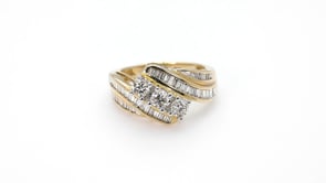 1 ct. tw. Three Stone Prong-Set Fashion Diamond Ring with Side Channel Baguette Diamonds in 10K Yellow Gold close-up detail