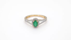 Green Oval Emerald and 1/6 ct. tw. Diamond Fashion Ring with Halo close-up detail