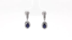 Blue Oval Sapphire and 1/10 ct. tw. Diamond Halo Earrings with Milgrain and Filigree Design in 10K White Gold close-up detail