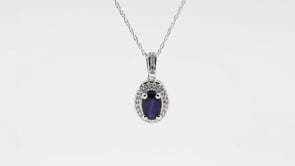 Blue Sapphire and .08 ct. tw. Diamond Oval Halo Pendant in 10K White Gold front view