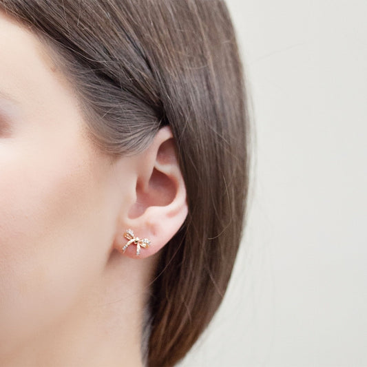 Love Knot 1/10 ct. tw. Diamond Bow Earrings in 10K Pink Gold close-up detail