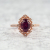 garnet and diamond pink gold ring beauty shot