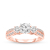 Round diamond three stone open engagement ring in pink gold