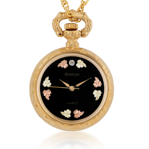 Gold-tone stainless steel watch pendant with green and pink gold leaves on a black dial
