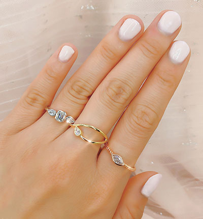 diamond and gold rings on model
